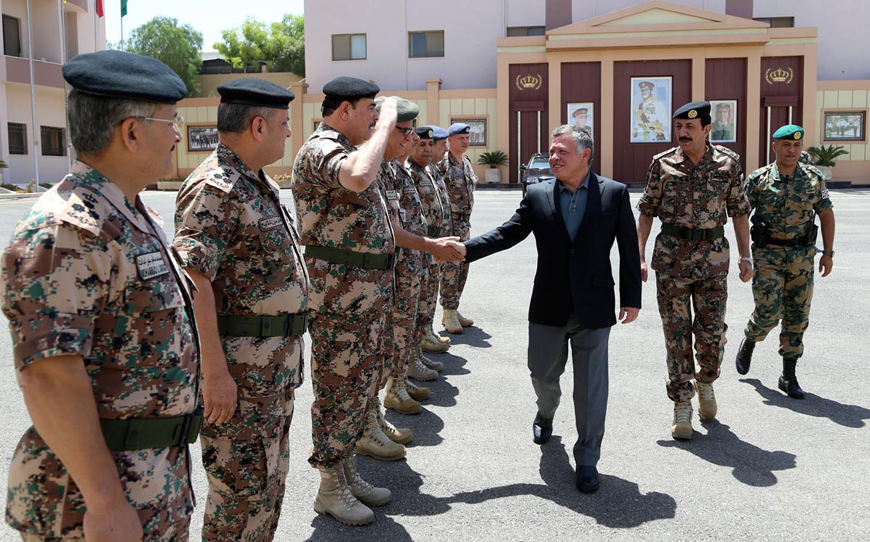 His Majesty King Abdullah is greeted by senior military officers upon his arrival at the Jordan Armed Forces-Arab Army headquarters on Tuesday (Photo courtesy of Royal Court)